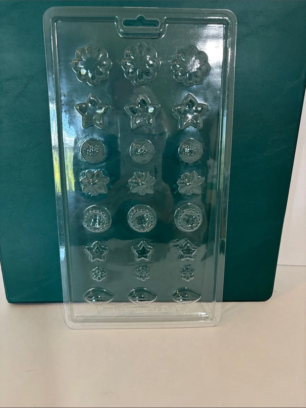 Wilton Clear Candy Mold Set with stars, shells, flowers.